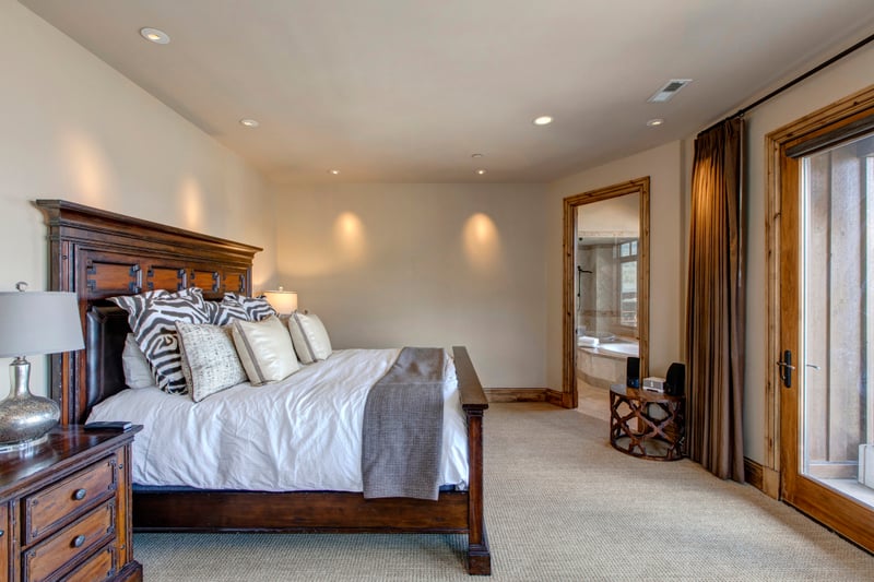 The top-floor master includes a King bed, vaulted ceilings, and ensuite bath with spa finishes.